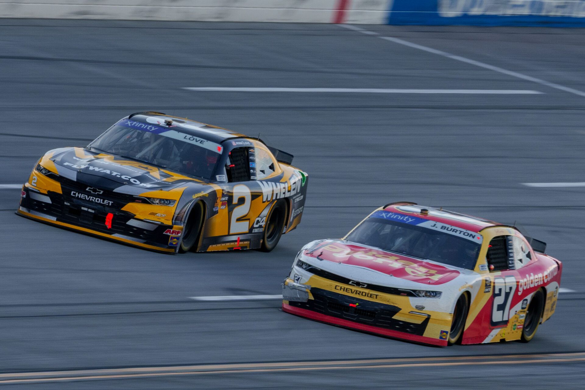 Xfinity Series driver Jesse Love (2) and Xfinity Series driver Jeb Burton (27) fight going into turn one at Talladega Superspeedway.