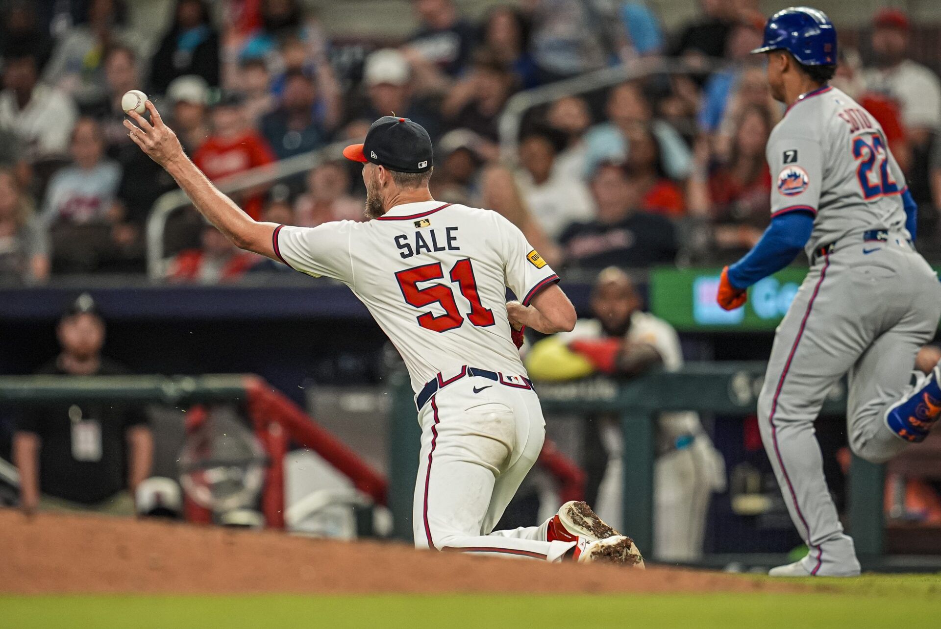 Atlanta Braves starting pitcher Chris Sale (51) throws out New York Mets right fielder Juan Soto (22) during the ninth inning at Truist Park.