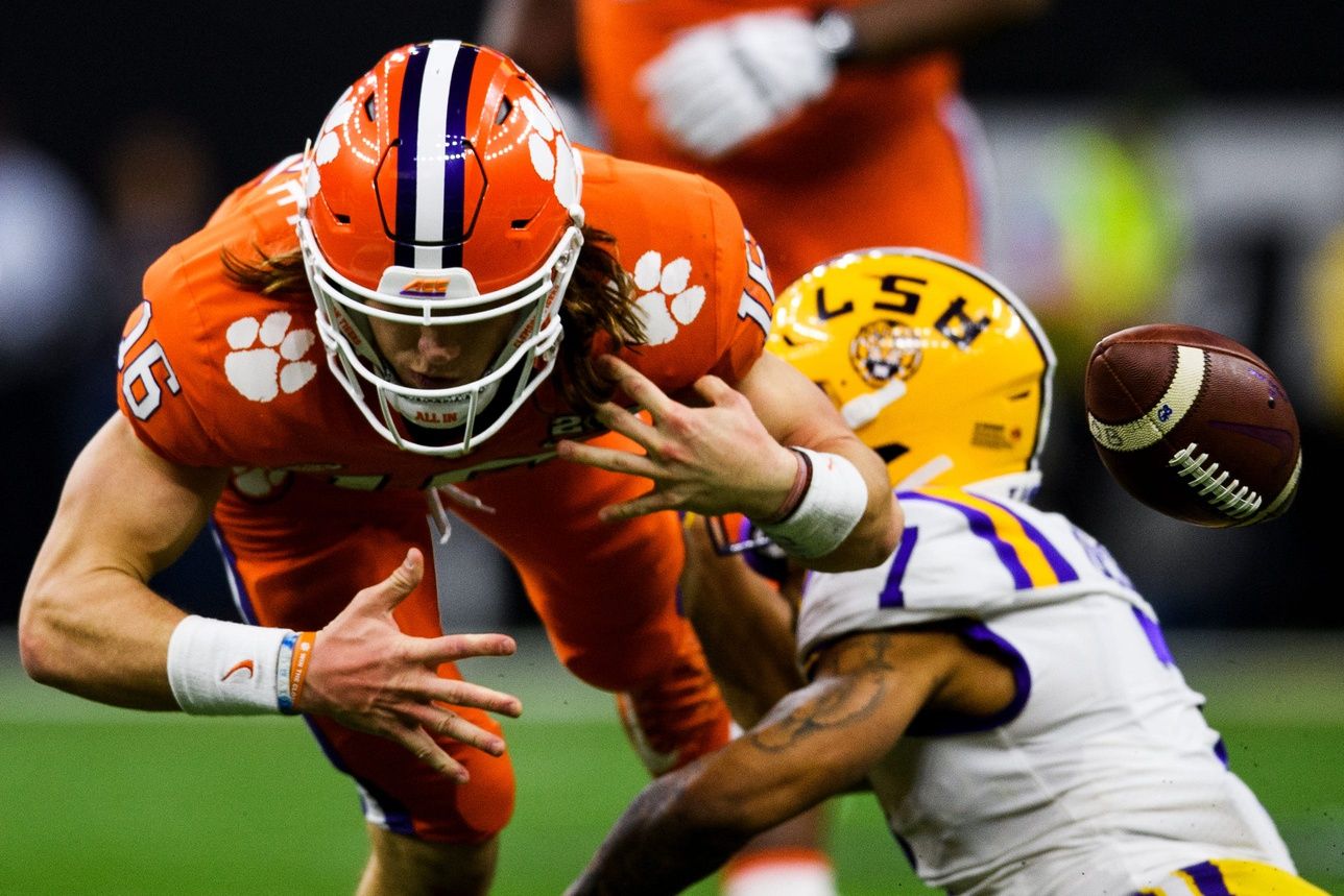 Clemson quarterback Trevor Lawrence (16) fumbles the ball after getting hit by LSU defensive back Grant Delpit (7) during the College Football National Championship game at the Mercedes Benz Superdome Monday, Jan. 13, 2020.

Jm Poy 006
