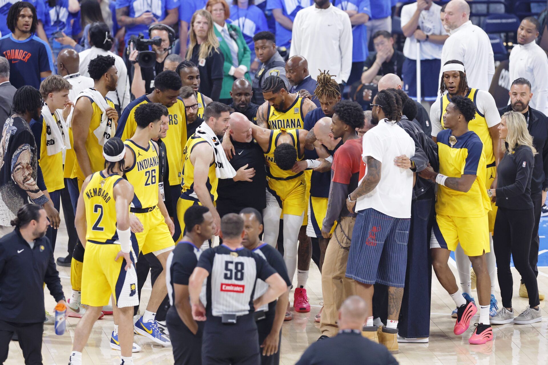 Indiana Pacers guard Tyrese Haliburton (0) is assisted after an apparent injury following a play against the Oklahoma City Thunder during the first half of game seven of the 2025 NBA Finals at Paycom Center.