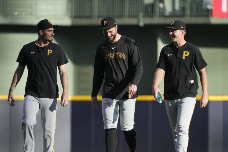 Pittsburgh Pirates pitcher Paul Skenes (30), center walks in from the outfield before a game against the Milwaukee Brewers  at American Family Field.
