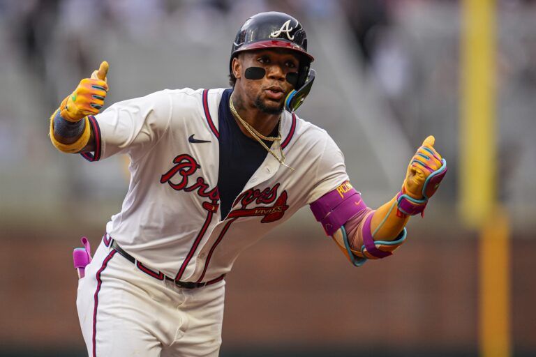 Atlanta Braves right fielder Ronald Acuna Jr (13) reacts after hitting a lead off home run against the New York Mets during the first inning at Truist Park.