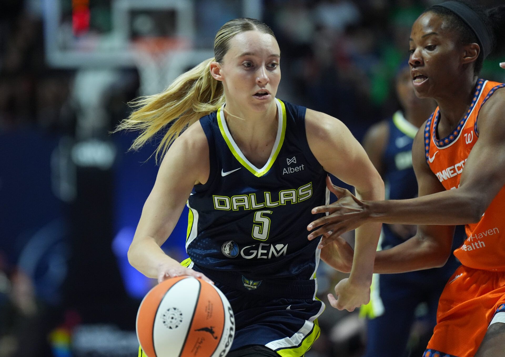 Dallas Wings guard Paige Bueckers (5) drives the ball against Connecticut Sun guard Lindsay Allen (15) in the first half at Mohegan Sun Arena.