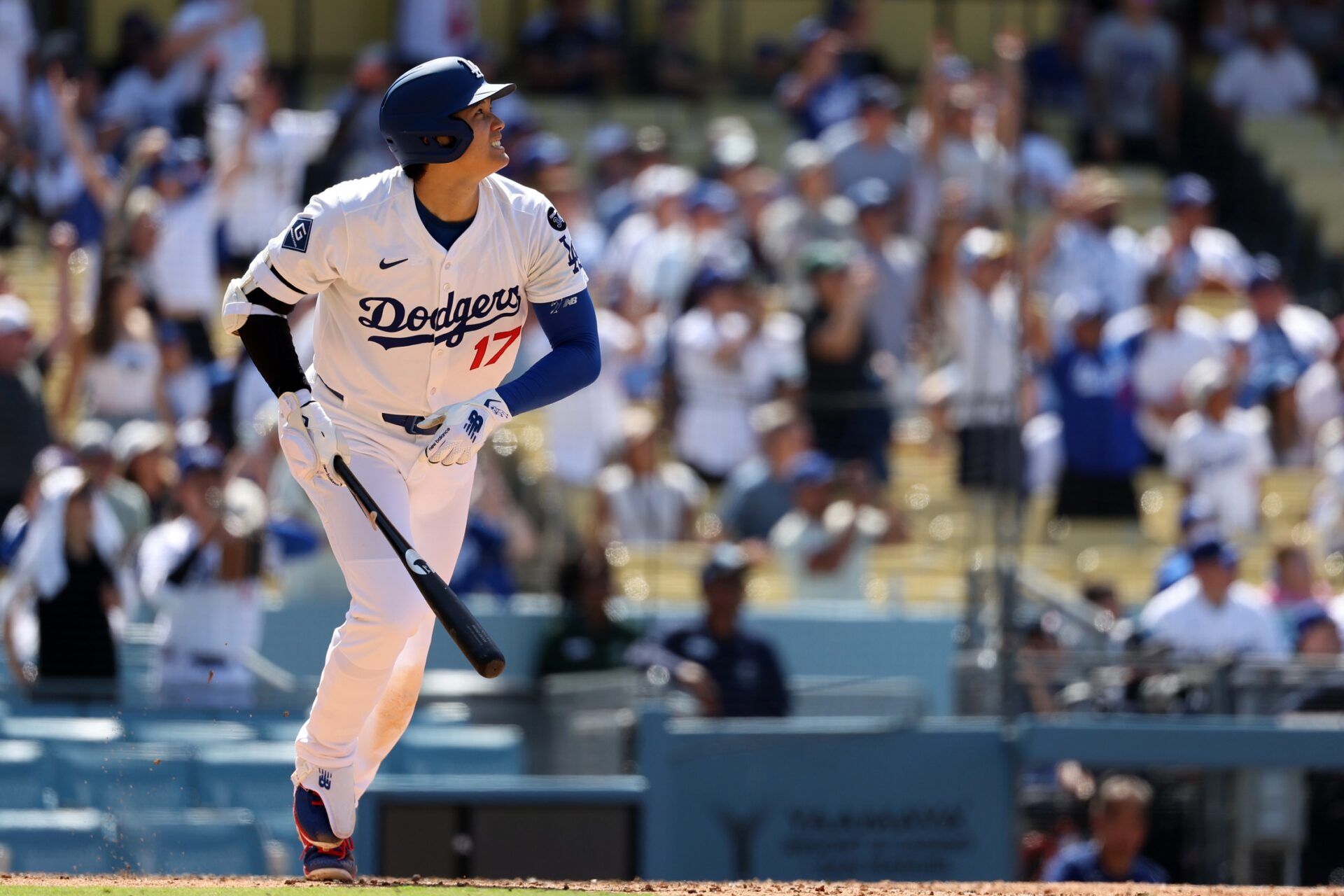 Los Angeles Dodgers two-way player Shohei Ohtani (17) hits a two-run home run during the eighth inning against the Washington Nationals at Dodger Stadium.