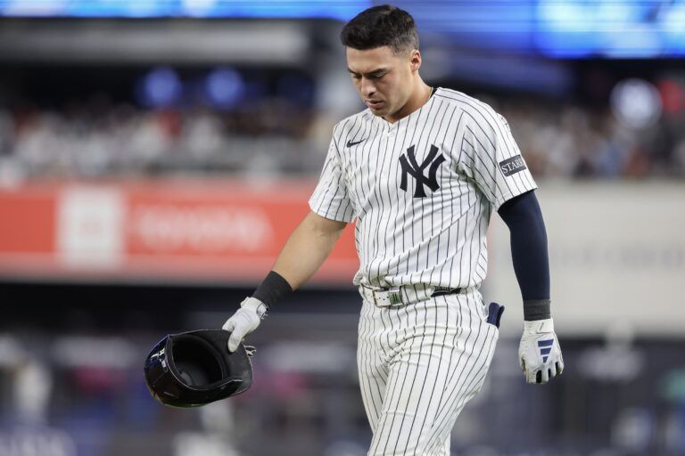 New York Yankees shortstop Anthony Volpe (11) walks back to the field after hitting into an inning ending double play in the seventh inning against the Cleveland Guardians at Yankee Stadium.