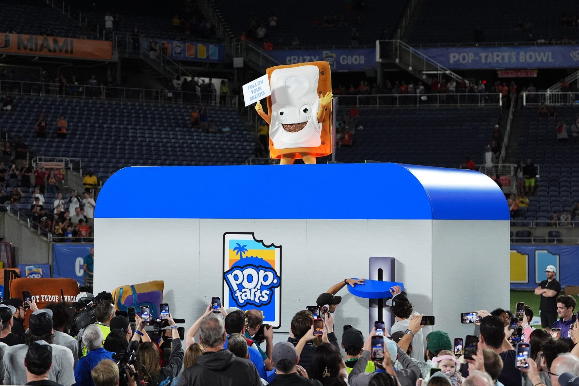 The Cinnamon Pop-Tart mascot goes into a toaster to be toasted after the Iowa State Cyclones defeatied the Miami Hurricanes at Camping World Stadium.