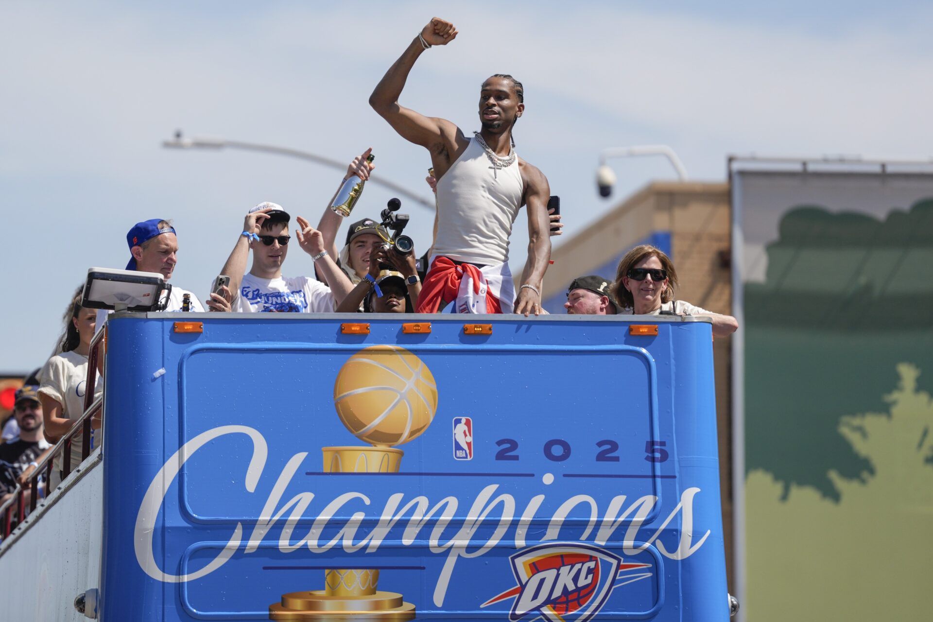 Oklahoma City Thunder guard Shai Gilgeous-Alexander gestures to the crowd as the  Oklahoma City Thunder celebrate their first NBA Finals title win with a champions parade throughout downtown Oklahoma City on Tuesday, June 24, 2025.
