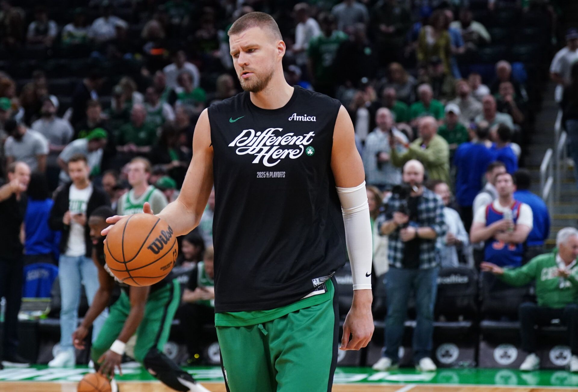 Boston Celtics center Kristaps Porzingis (8) warms up before the start of game two of the second round for the 2025 NBA Playoffs against the New York Knicks at TD Garden.