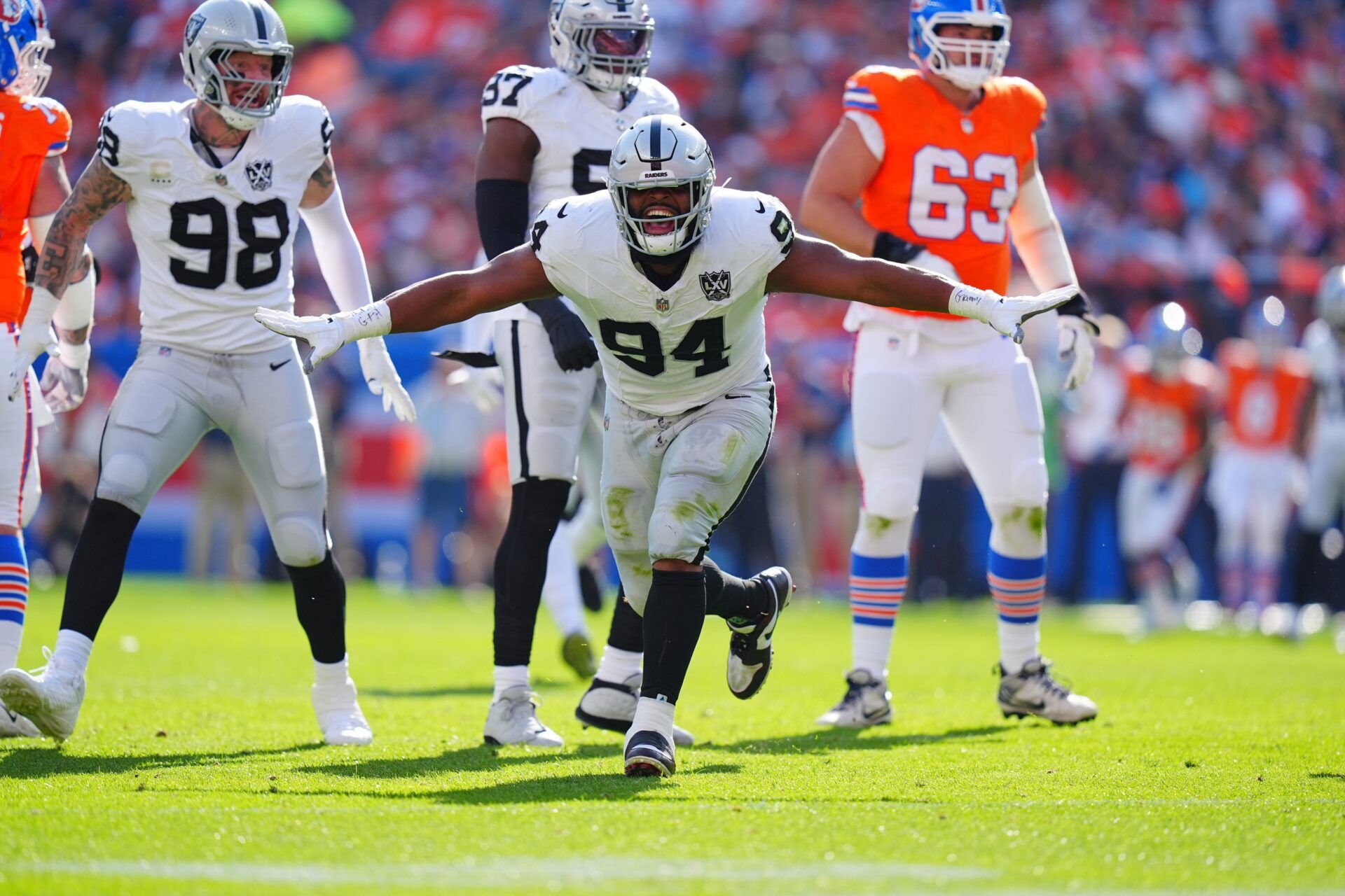 Las Vegas Raiders defensive tackle Christian Wilkins (94) celebrates his sack in the second quarter against the Denver Broncos at Empower Field at Mile High.