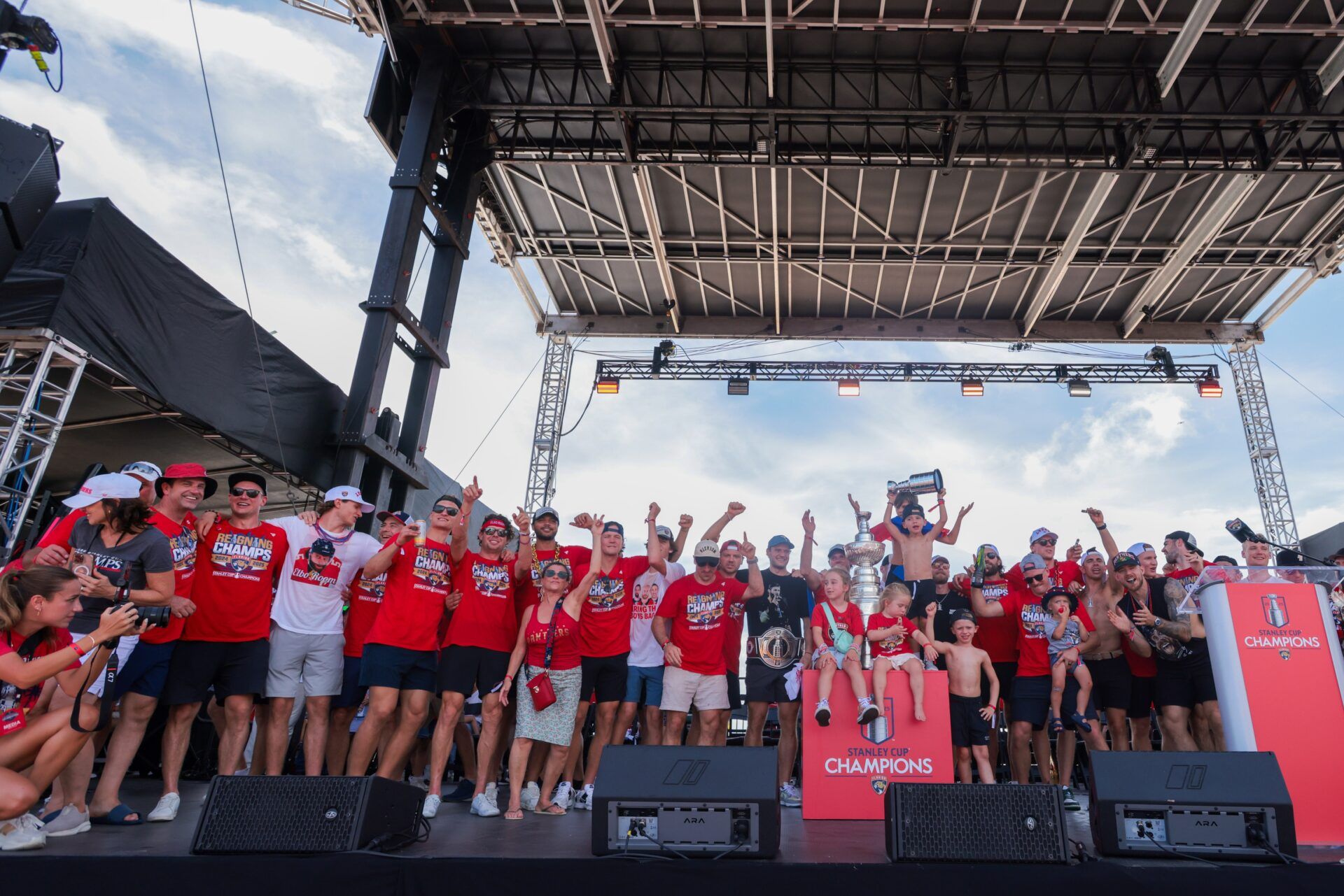Florida Panthers players and family members wave at the fans during the Stanley Cup championship parade and rally.