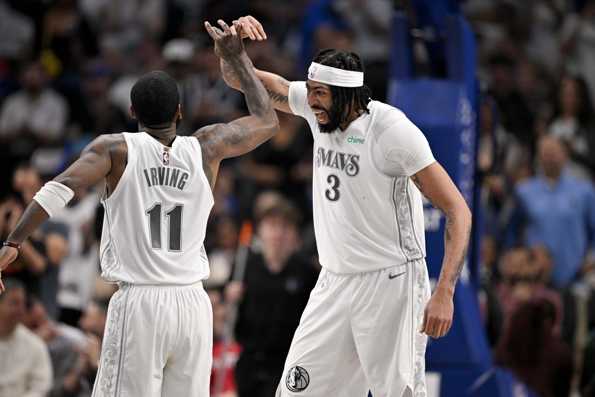 Dallas Mavericks forward Anthony Davis (3) and guard Kyrie Irving (11) celebrates after Davis dunks the ball during the game between the Dallas Mavericks and the Houston Rockets at the American Airlines Center.