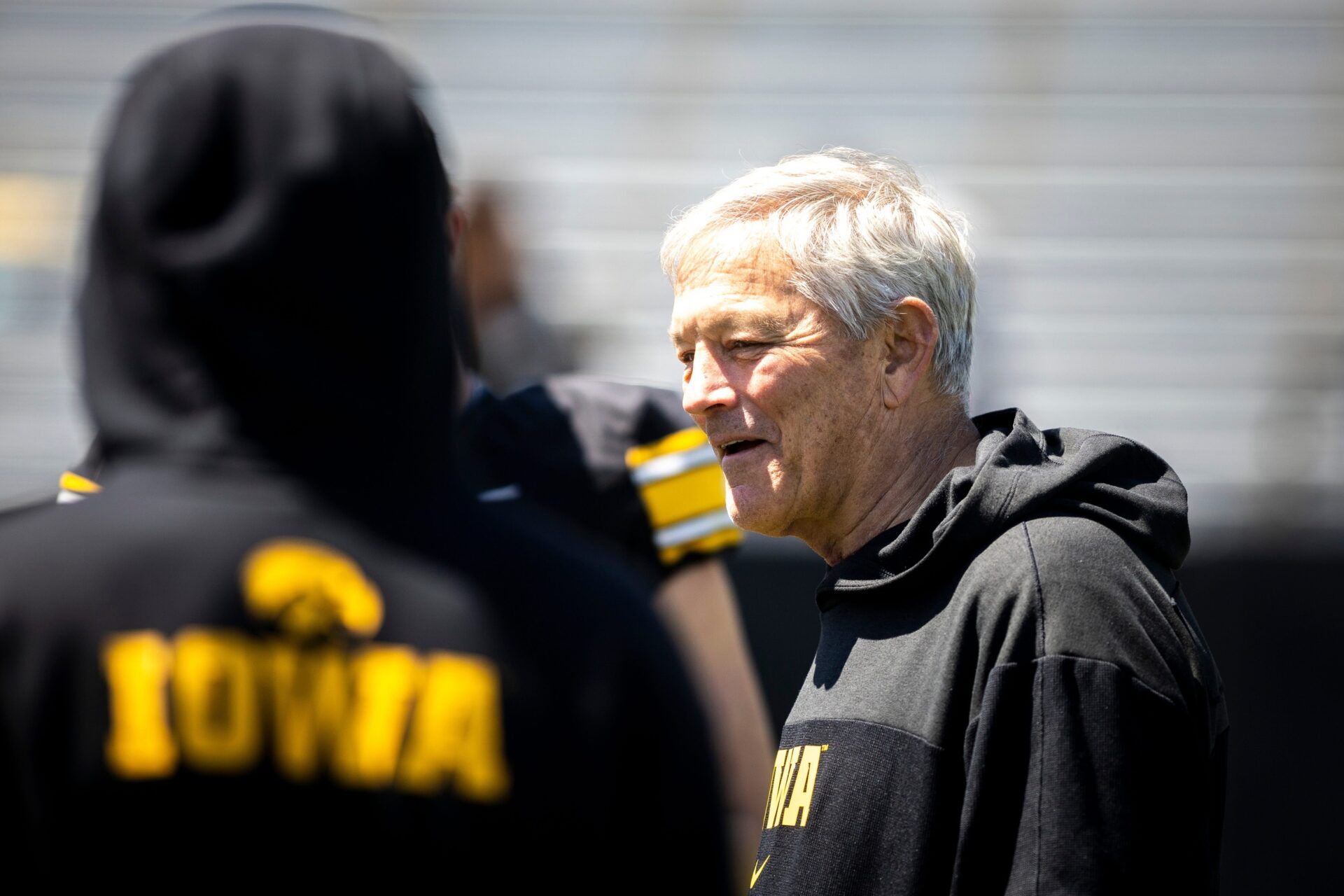 Iowa head coach Kirk Ferentz talks with players after a spring NCAA football open practice at Kinnick Stadium.