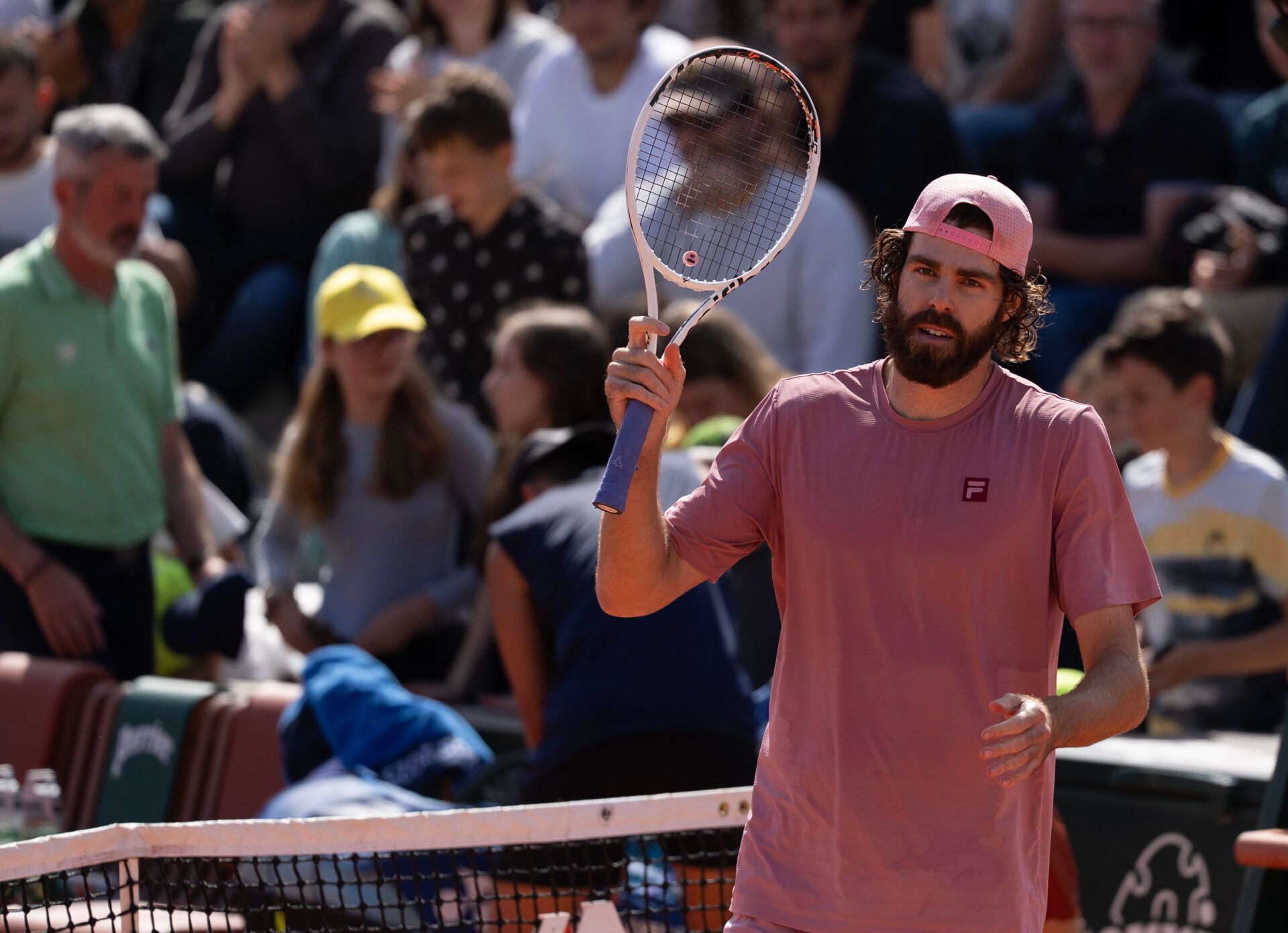 Reilly Opelka of the United States reacts to winning his match against Rinky Hijikata of Australia on day one at Roland Garros Stadium.