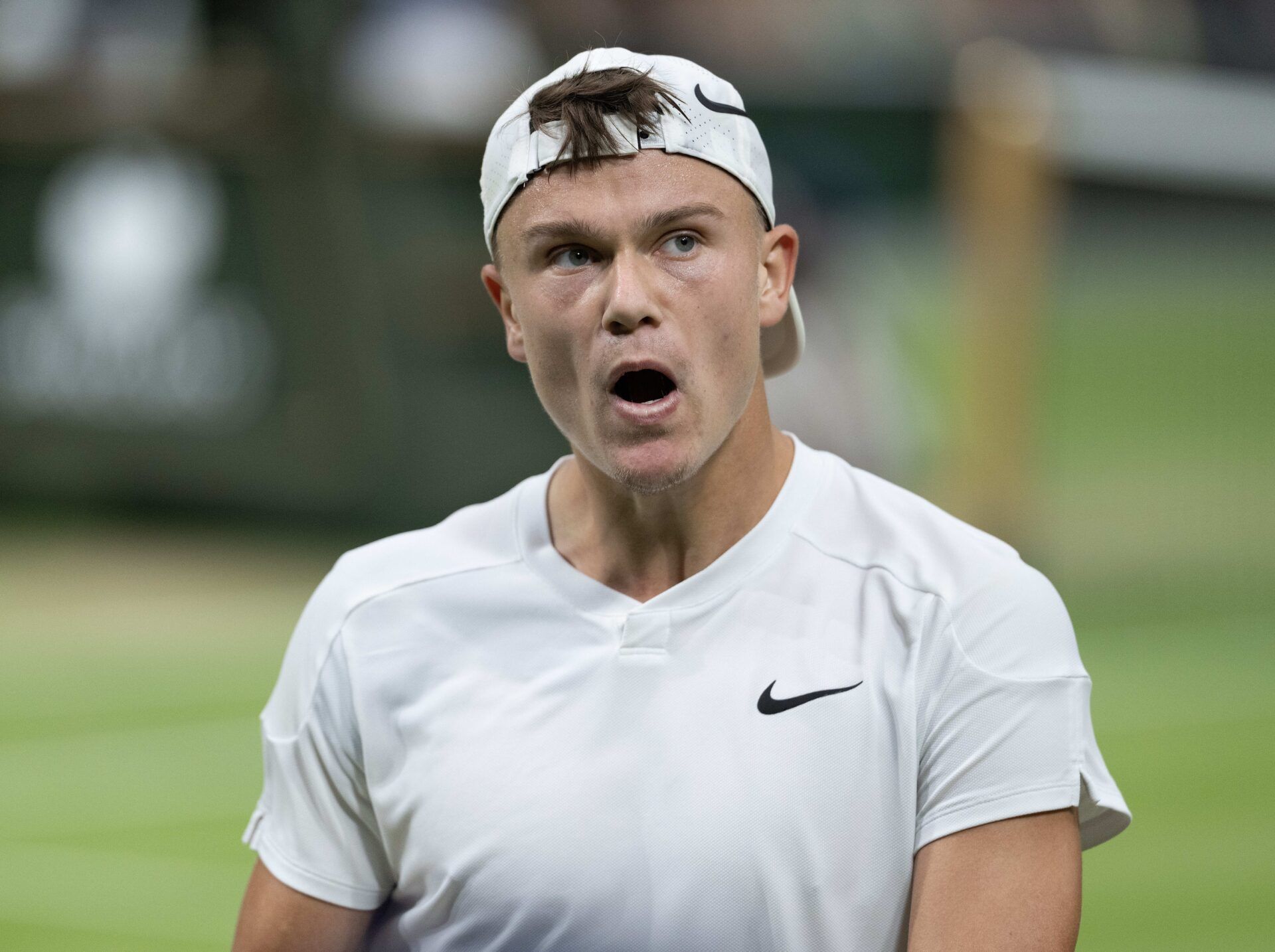 Holger Rune of Denmark reacts to a point during his match against Novak Djokovic of Serbia (not shown) on day eight of The Championships at All England Lawn Tennis and Croquet Club.