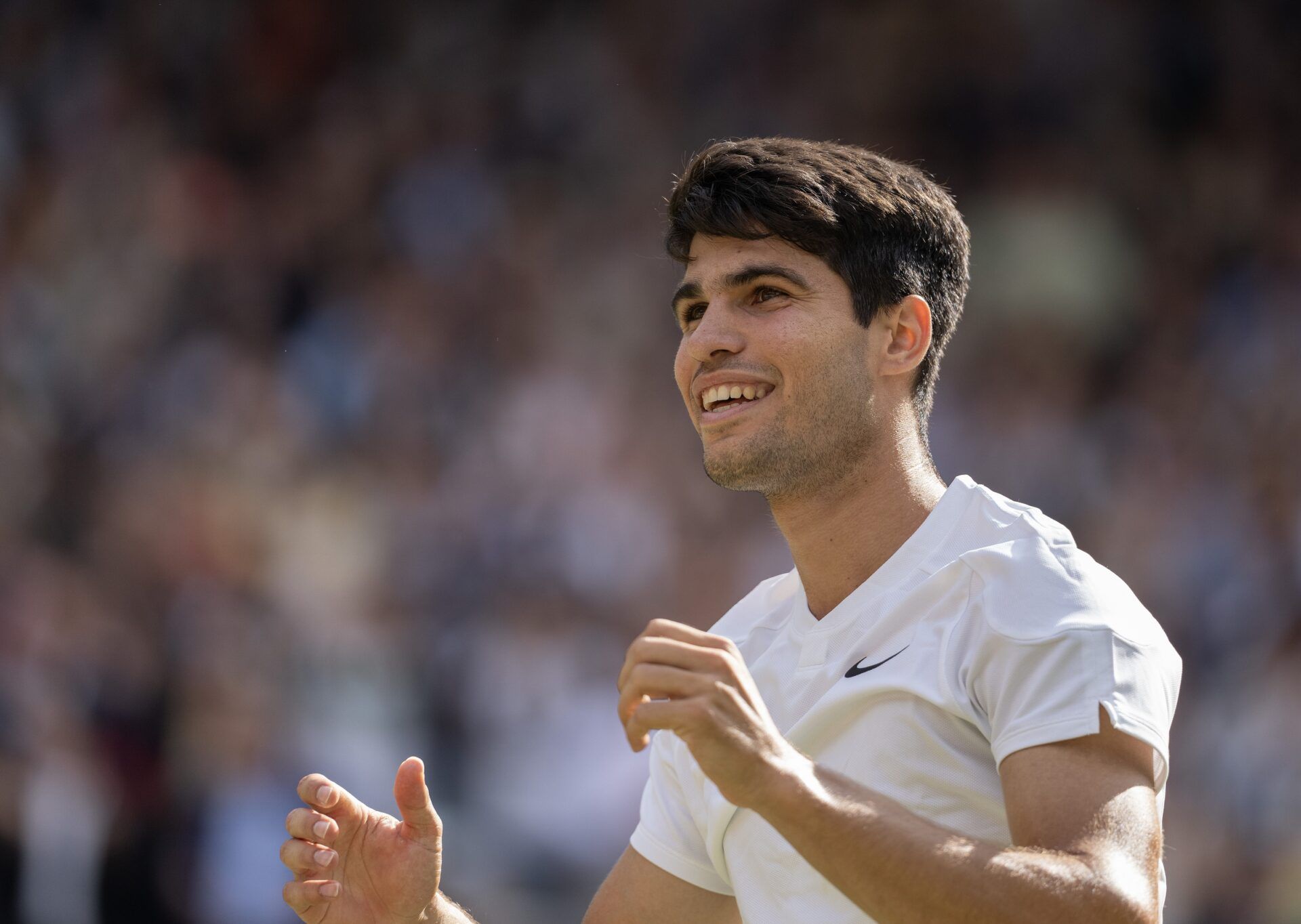 Carlos Alcaraz of Spain celebrates winning the menÕs singles match against Novak Djokovic of Serbia on day 14 at All England Lawn Tennis and Croquet Club.