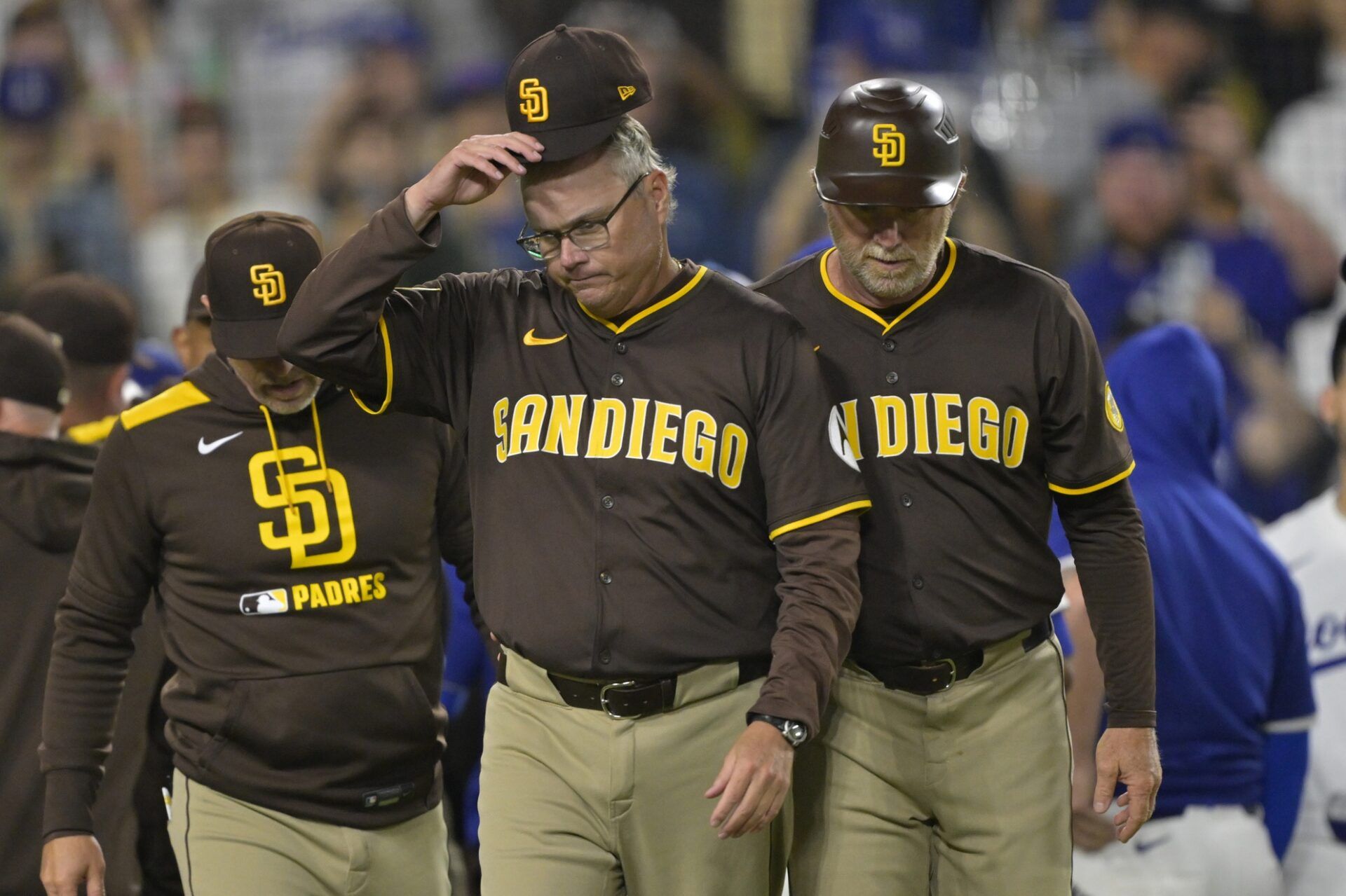 Jun 19, 2025; San Diego Padres manager Mike Shildt (8) and third base coach Tim Leiper (33) walk back to the dugout after after benches cleared in the eighth inning against the Los Angeles Dodgers at Dodger Stadium.