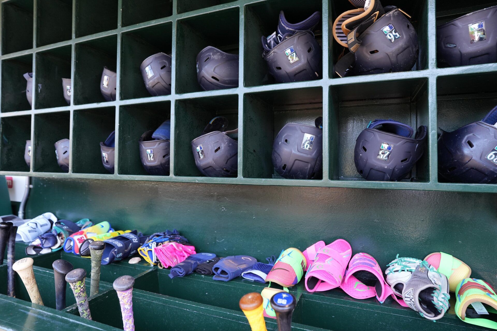 Seattle Mariners batting helmets in the dugout during the game against the Los Angeles Angels at Angel Stadium.