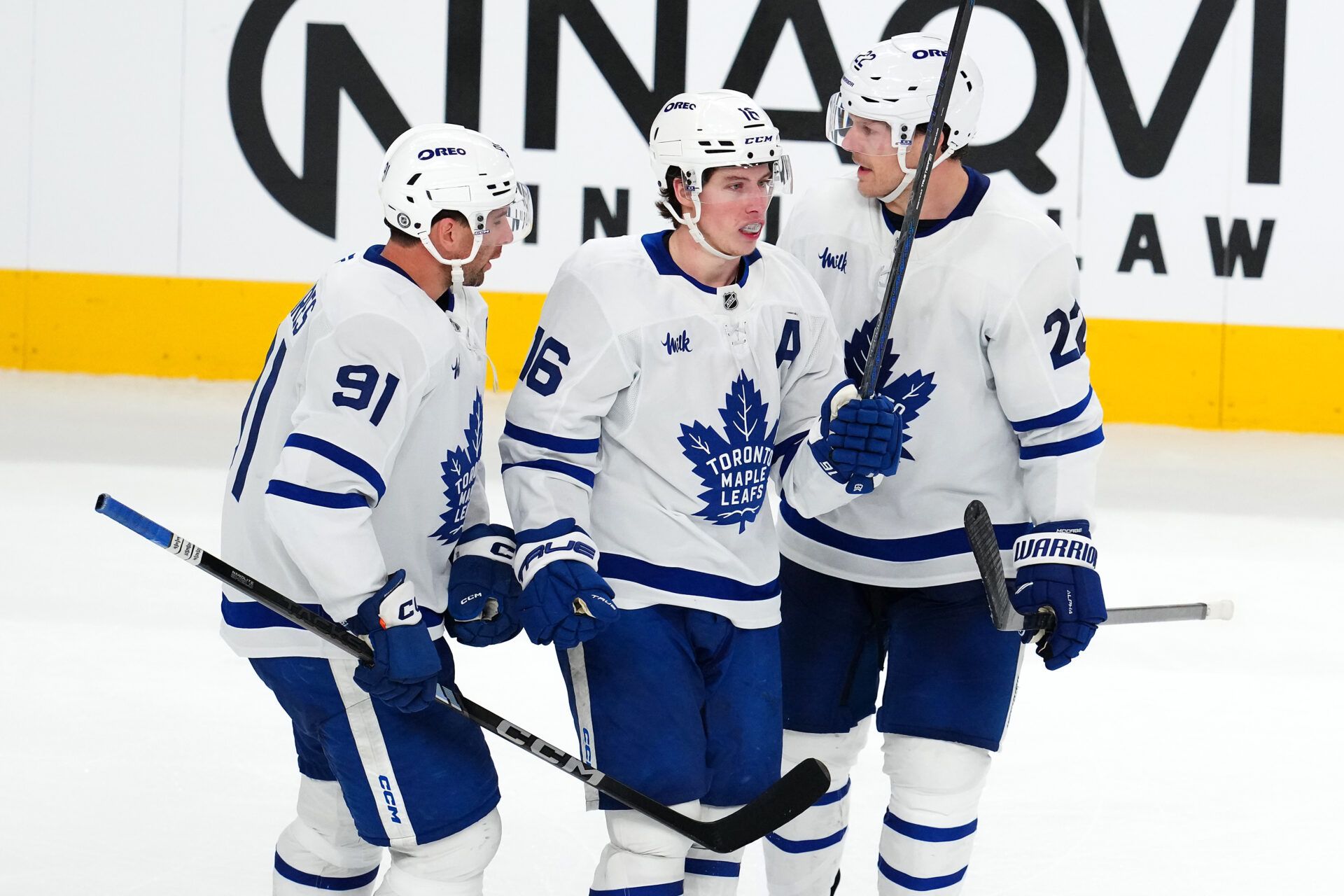 Toronto Maple Leafs right wing Mitch Marner (16) celebrates with Toronto Maple Leafs center John Tavares (91) and Toronto Maple Leafs defenseman Jake McCabe (22) after scoring a goal against the Vegas Golden Knights during the third period at T-Mobile Arena.