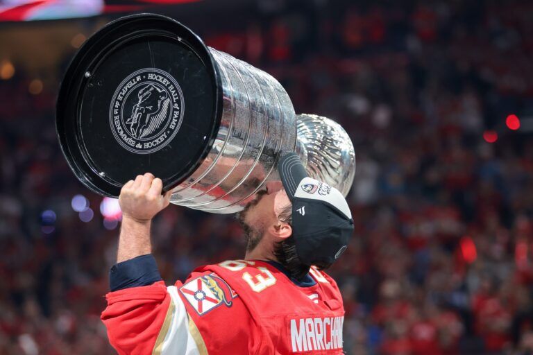 Florida Panthers center Brad Marchand (63) hoists the Stanley Cup after winning game six of the 2025 Stanley Cup Final against the Edmonton Oilers at Amerant Bank Arena.