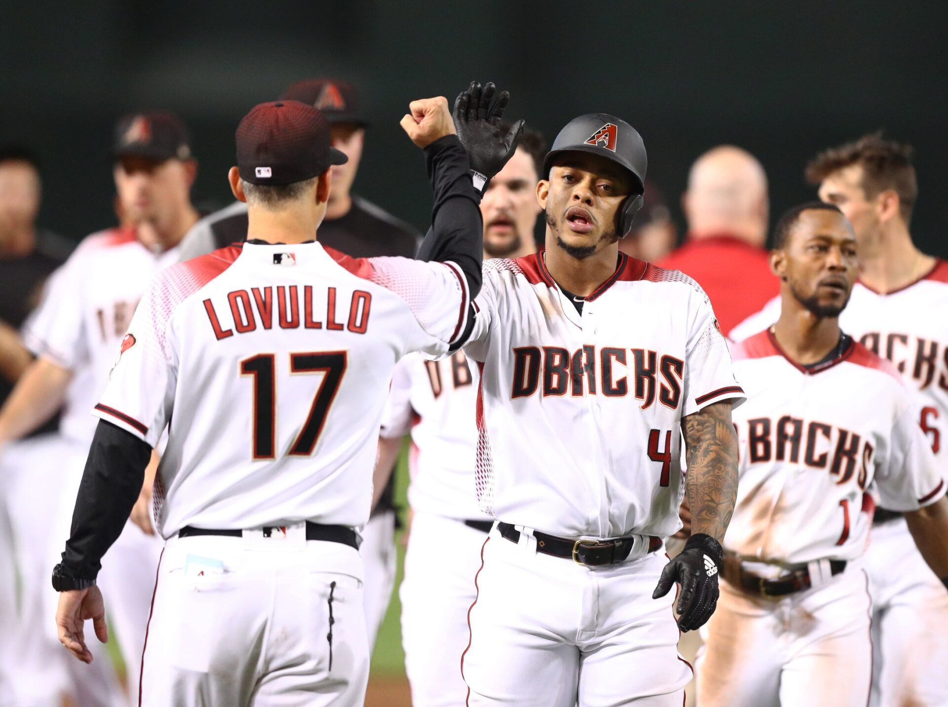 Arizona Diamondbacks second baseman Ketel Marte (right) celebrates with manager Torey Lovullo after defeating the Los Angeles Dodgers at Chase Field.