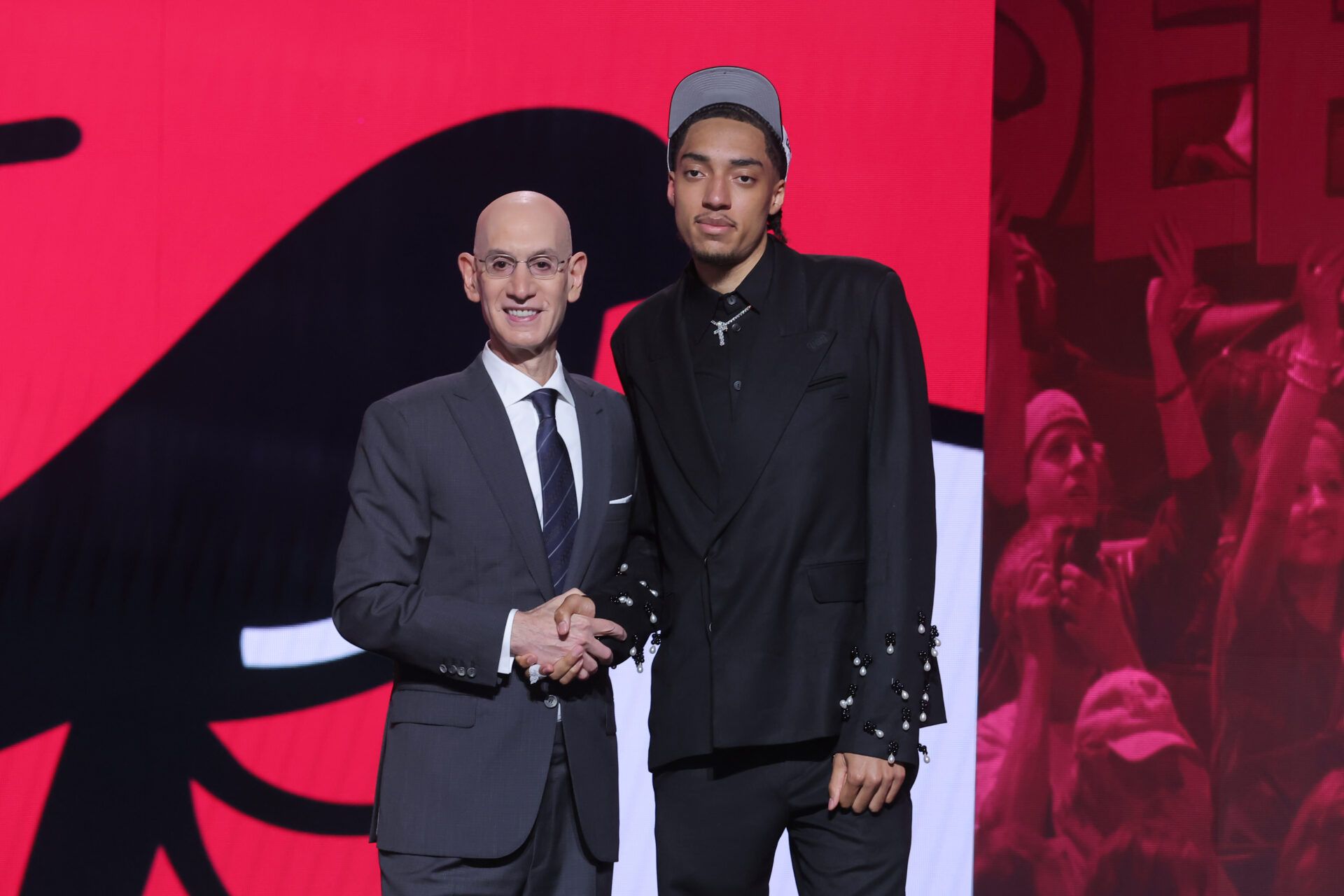 Noa Essengue stands with NBA commissioner Adam Silver after being selected as the 12th pick by the Chicago Bulls in the first round of the 2025 NBA Draft at Barclays Center.