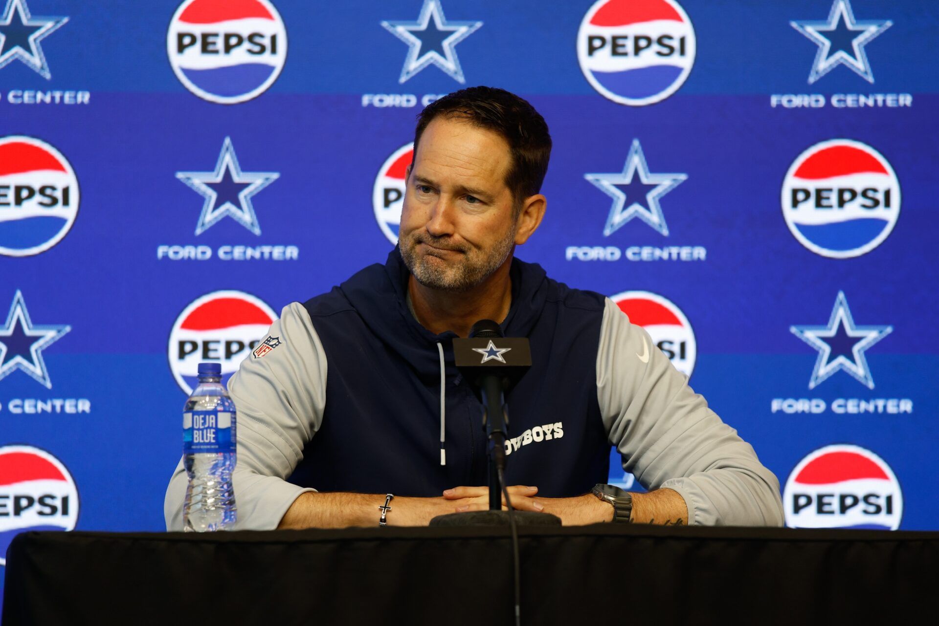 Dallas Cowboys head coach Brian Schottenheimer addresses the media before practice at the Ford Center at the Star Training Facility in Frisco, Texas.