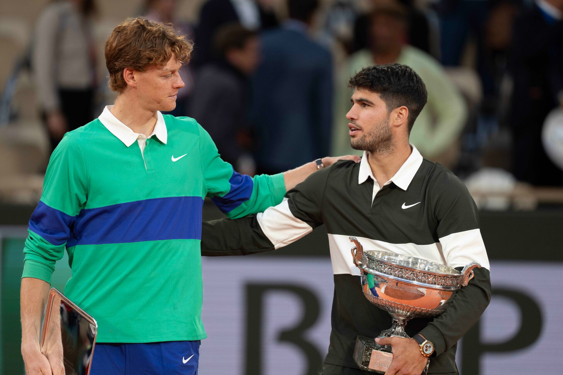 Jannik Sinner of Italy and Carlos Alcaraz of Spain pose together at the trophy presentation after the men’s singles final on day 15 at Roland Garros Stadium.