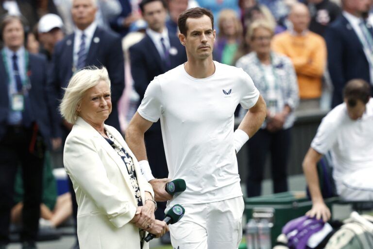 Andy Murray (GBR) watches a tribute video during a ceremony honoring his Wimbledon career alongside former BBC presenter Sue Barker (L) after participating in a gentlemen's doubles match with brother Jamie Murray (not pictured)(GBR) against Rinky Hijikata (AUS) and John Peers (AUS)(both not pictured) on day four of The Championships Wimbledon 2024 at All England Lawn Tennis and Croquet Club.