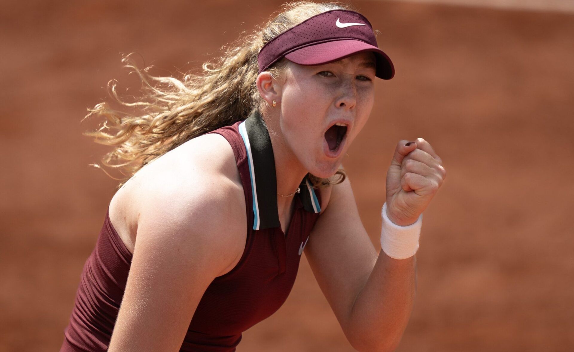 Mirra Andreeva reacts to winning the first set during her match against Ashlyn Krueger of the United States on day five at Roland Garros Stadium.
