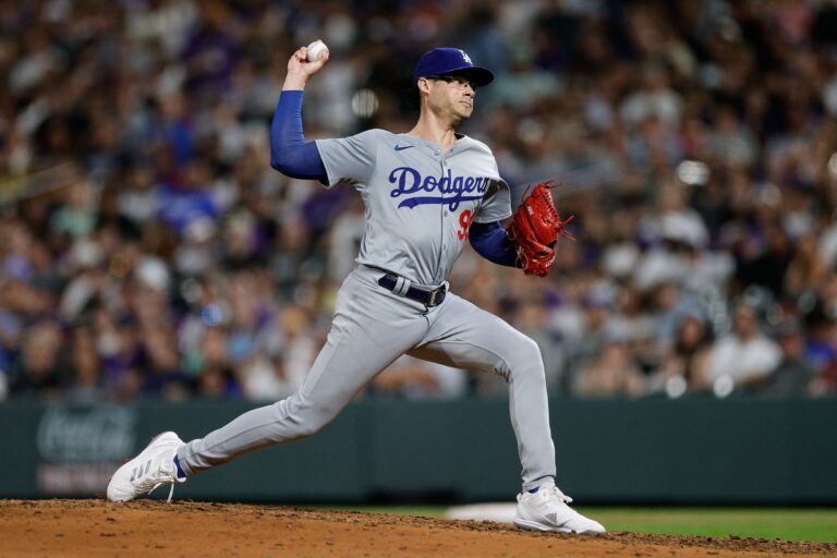 Los Angeles Dodgers relief pitcher Joe Kelly (99) pitches in the sixth inning against the Colorado Rockies at Coors Field.