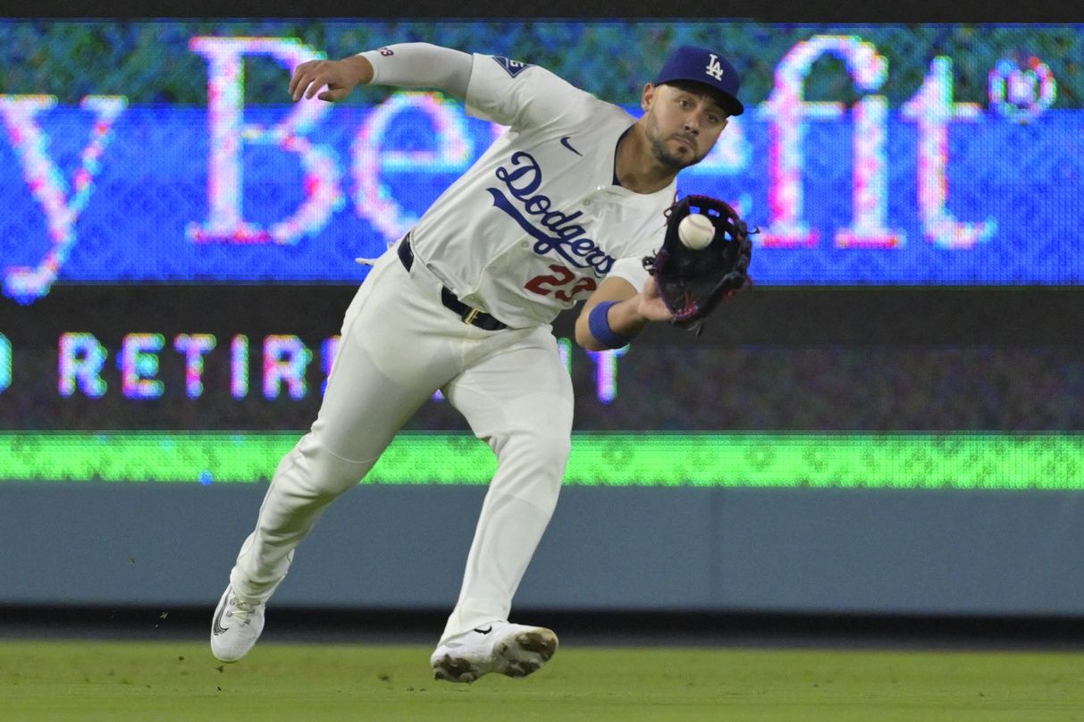 Los Angeles Dodgers left fielder Michael Conforto (23) makes a running catch off New York Mets third baseman Brett Baty (7) in the fifth inning at Dodger Stadium.