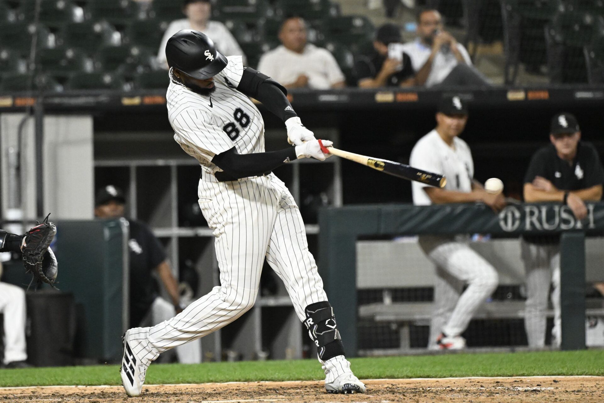 Chicago White Sox outfielder Luis Robert Jr. (88) hits a single during the ninth inning against the Arizona Diamondbacks at Rate Field.