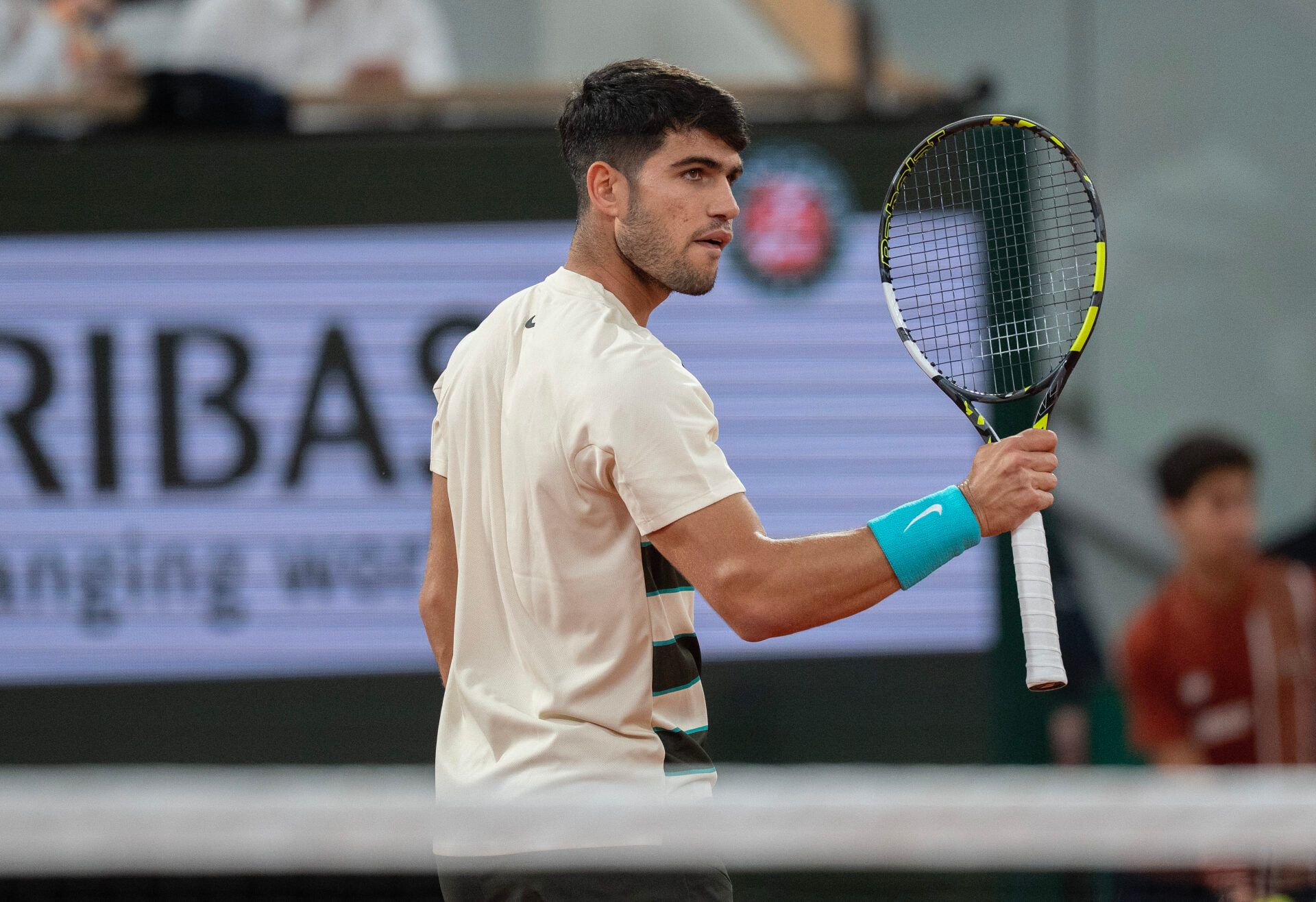 Carlos Alcaraz of Spain reacts to a point during his match against Lorenzo Musetti of Italy match on day 13 at Roland Garros Stadium.