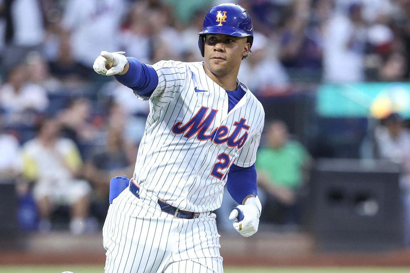 New York Mets right fielder Juan Soto (22) gestures to the dugout after hitting a solo home run in the fourth inning against the Atlanta Braves at Citi Field.
