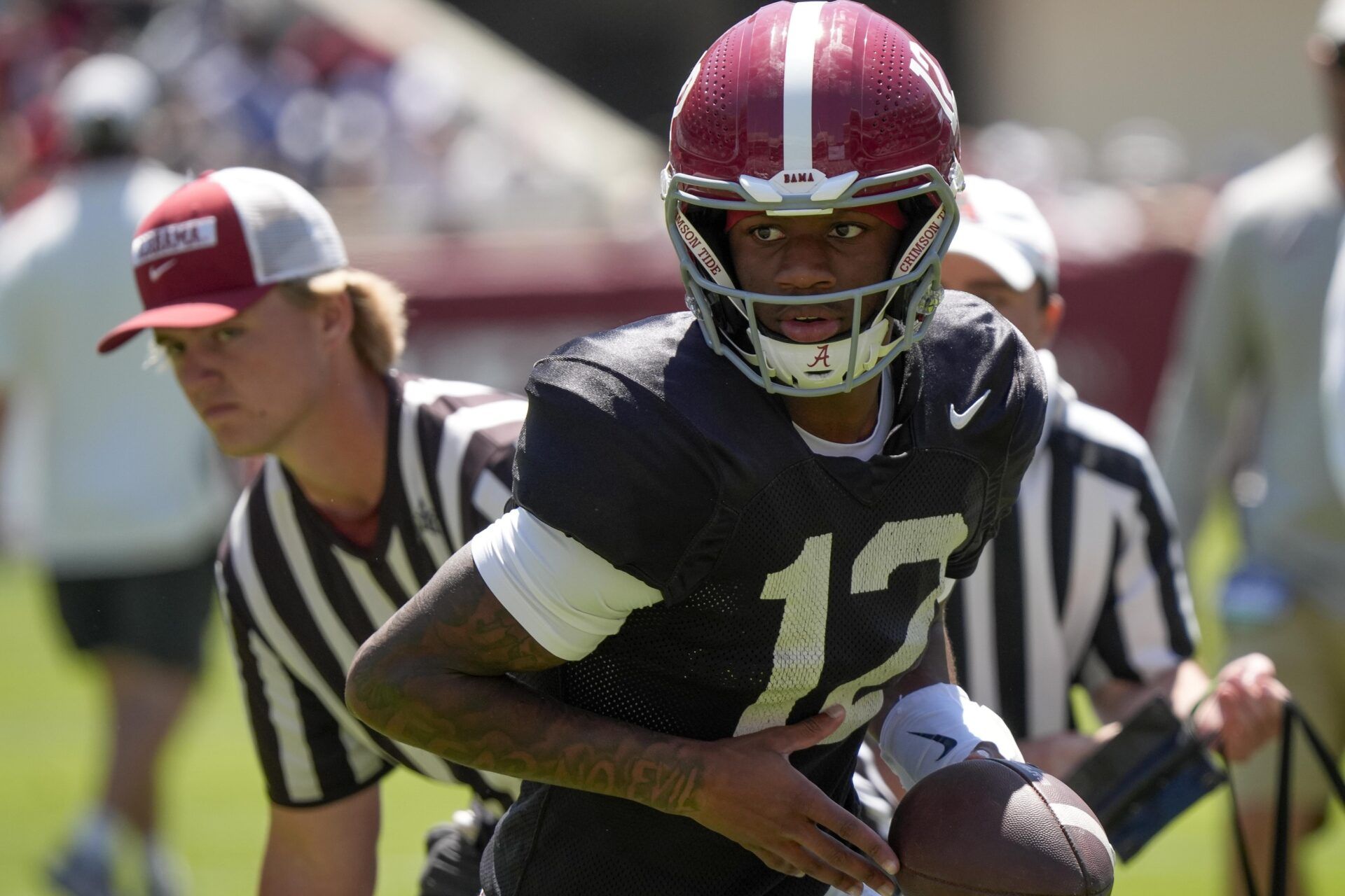 Alabama quarterback Keelon Russell (12) turn to hand off the ball during A-Day at Bryant-Denny Stadium.