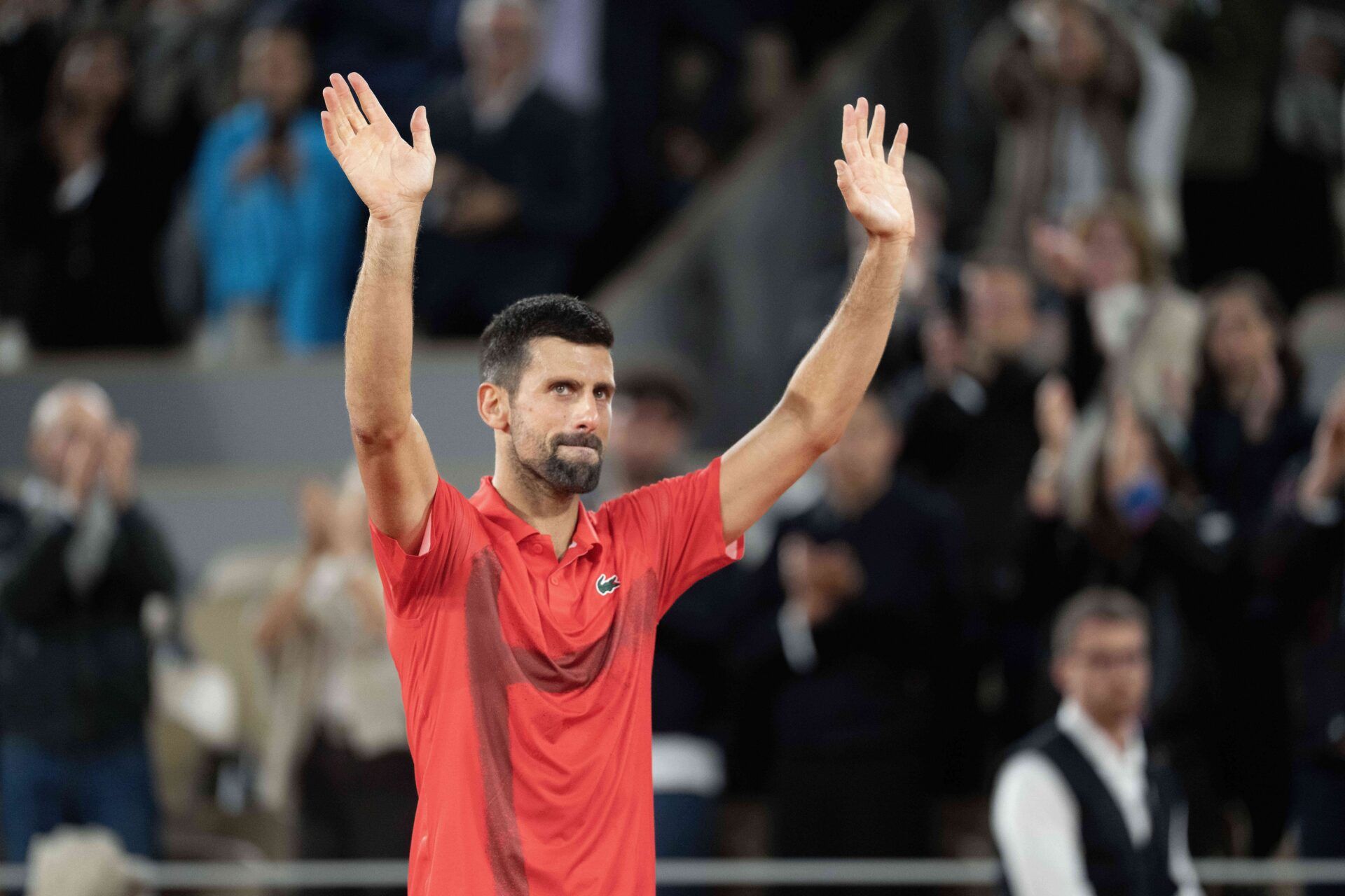 Novak Djokovic of Serbia says goodbye to the spectators and the clay after losing his match against Jannik Sinner of Italy on day 13 at Roland Garros Stadium.
