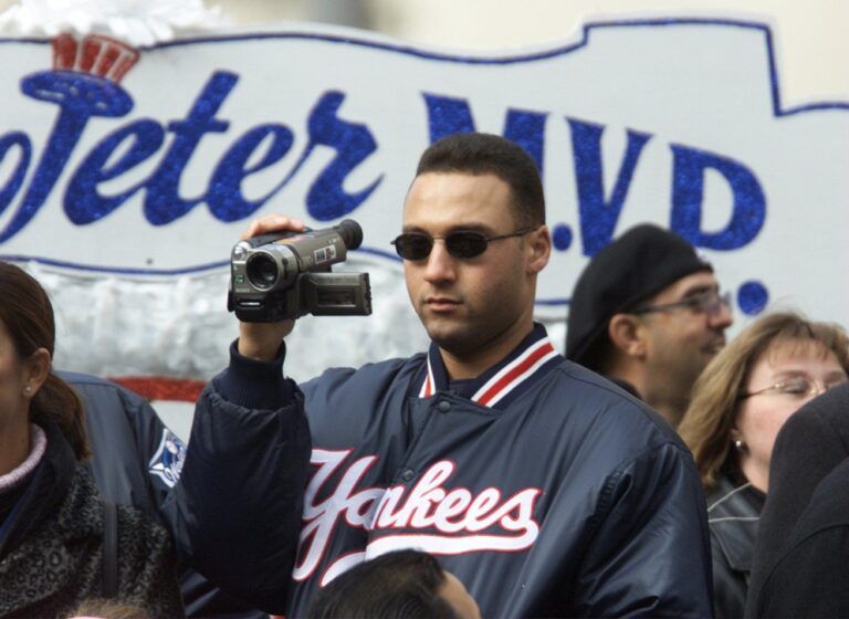 Yankees MVP Derek Jeter records the parade from a float during the Yankees Victory Parade from Battery Park to City Hall in New York City, NY Monday October 30, 2000.