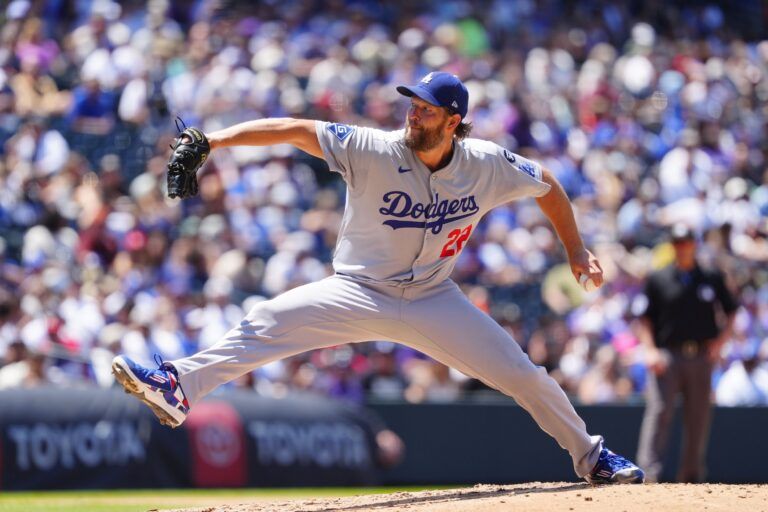 Los Angeles Dodgers starting pitcher Clayton Kershaw (22) delivers a pitch in the sixth inning against the Colorado Rockies at Coors Field.