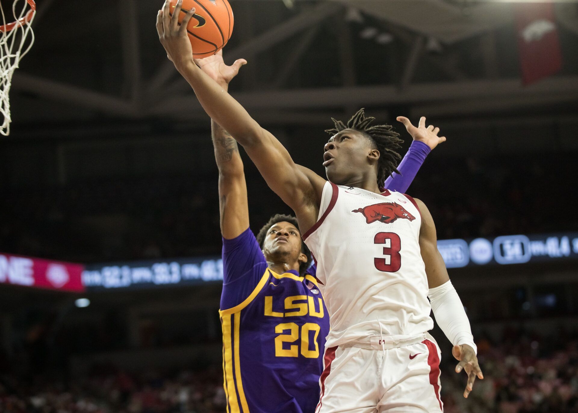 Arkansas Razorbacks forward Adou Thiero (3) goes for a layup past LSU Tigers forward Derek Fountain (20) during the second half at Bud Walton Arena. Arkansas won 70-58.