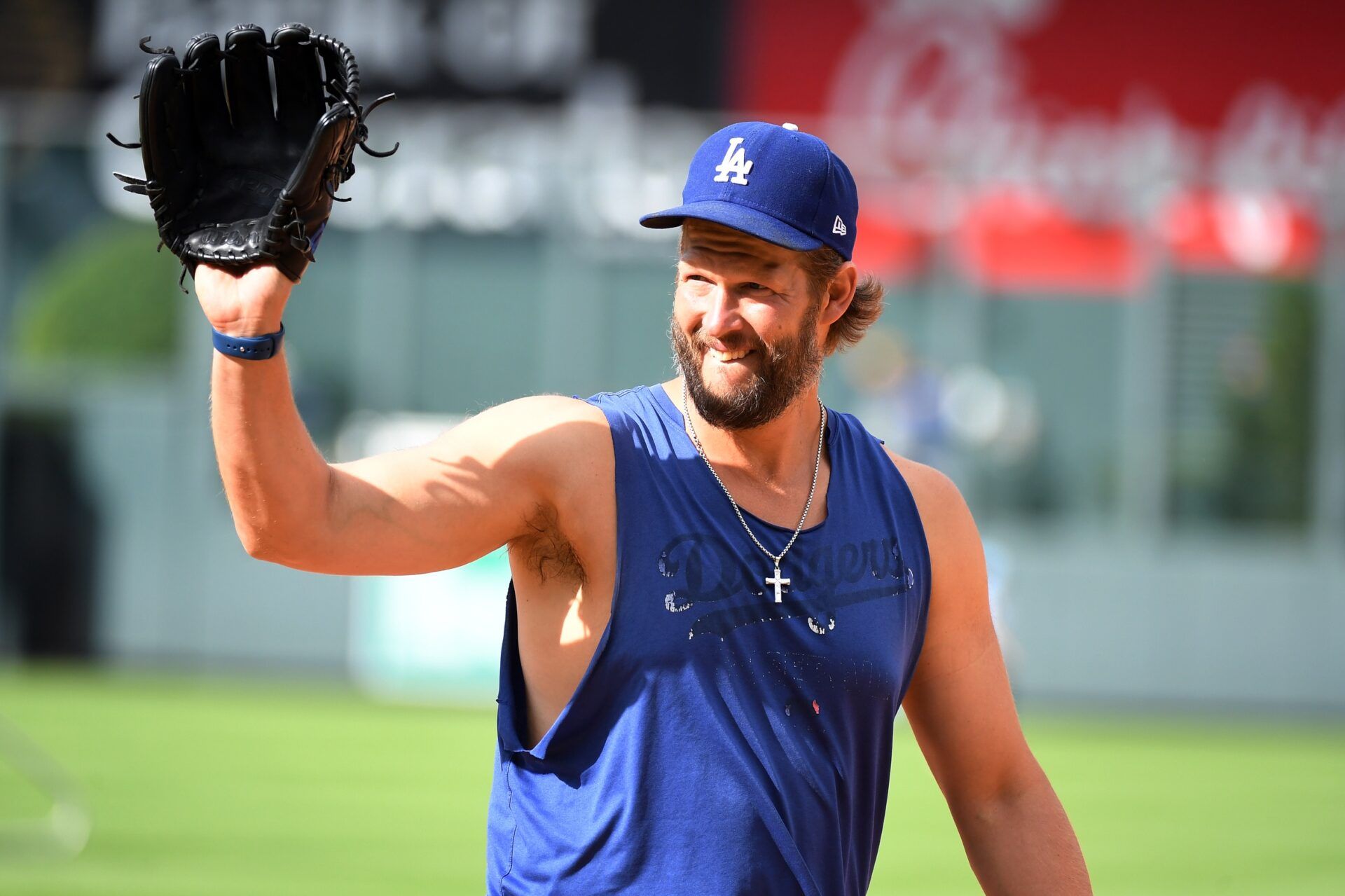 Los Angeles Dodgers pitcher Clayton Kershaw (22) walks off the field after warmups before the game against the Colorado Rockies at Coors Field.