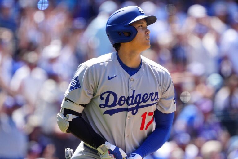 Los Angeles Dodgers designated hitter  Shohei Ohtani (17) hits a solo home run in the seventh inning against the Colorado Rockies at Coors Field.