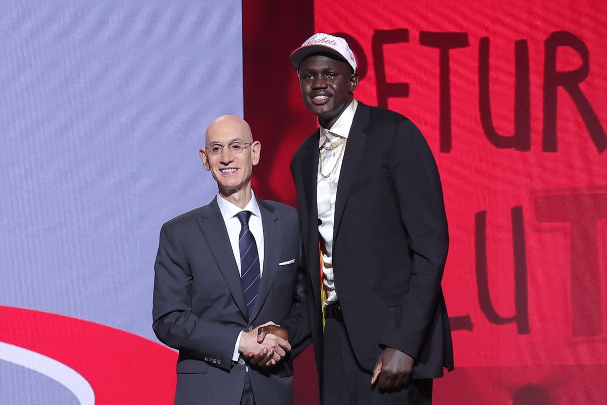 Khaman Maluach stands with NBA commissioner Adam Silver after being selected as the tenth pick by the Houston Rockets in the first round of the 2025 NBA Draft at Barclays Center.