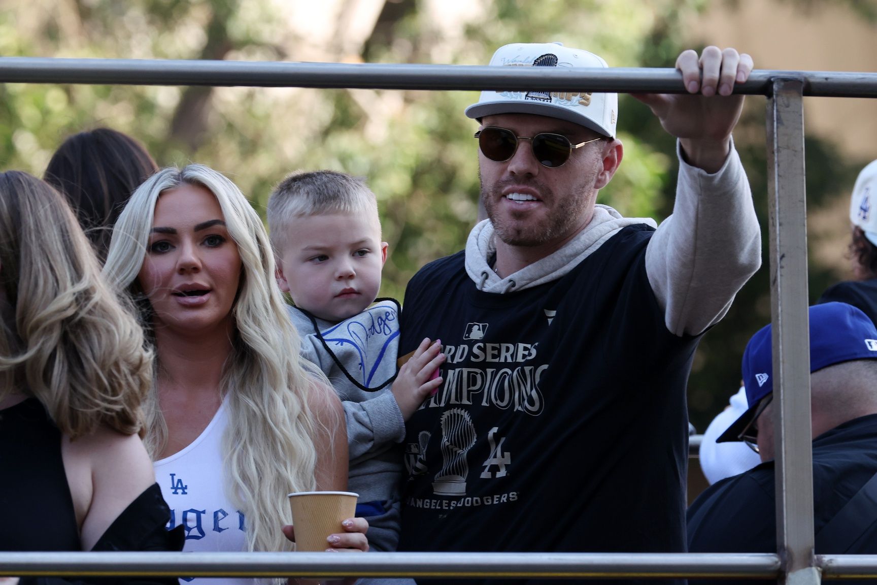 Los Angeles Dodgers first base Freddie Freeman (right) celebrates with his wife Chelsea Freeman during the 2024 World Series Championship parade in downtown Los Angeles.