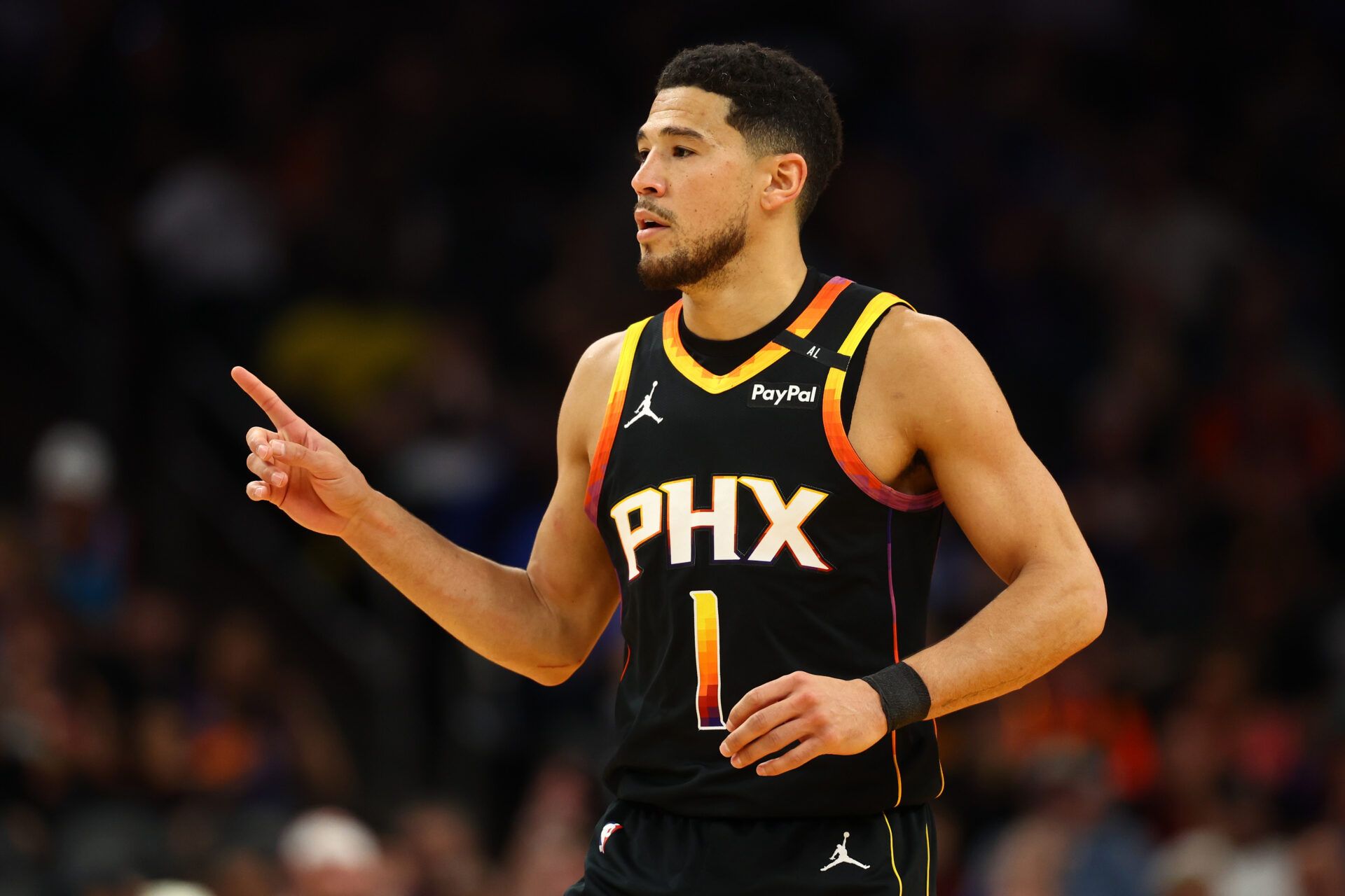 Phoenix Suns guard Devin Booker (1) reacts after a play against the Oklahoma City Thunder during the first half at Footprint Center.