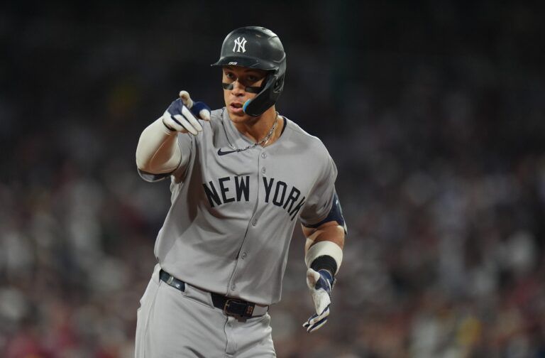 New York Yankees outfielder Aaron Judge (99) reacts to the crowd after hitting a home run against the Boston Red Sox in the ninth inning at Fenway Park.