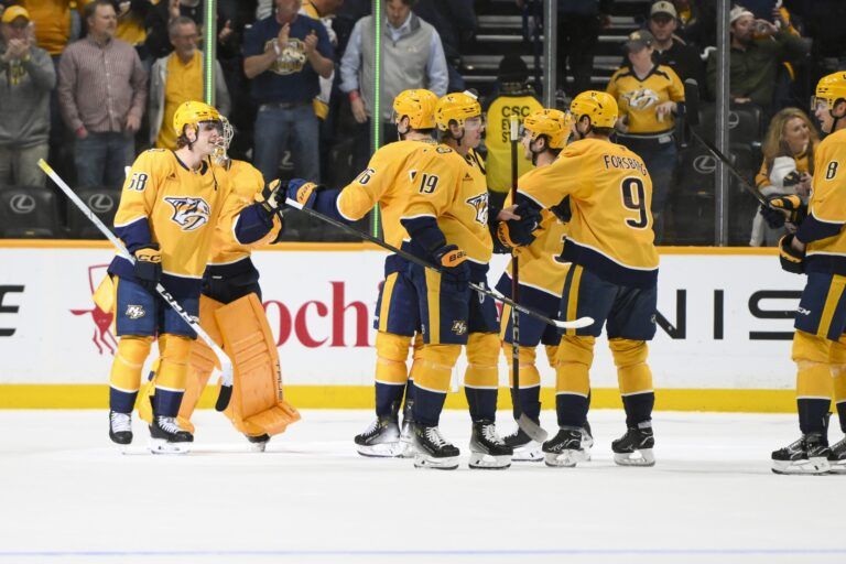 Nashville Predators celebrate the win against the Dallas Stars during the third period at Bridgestone Arena.