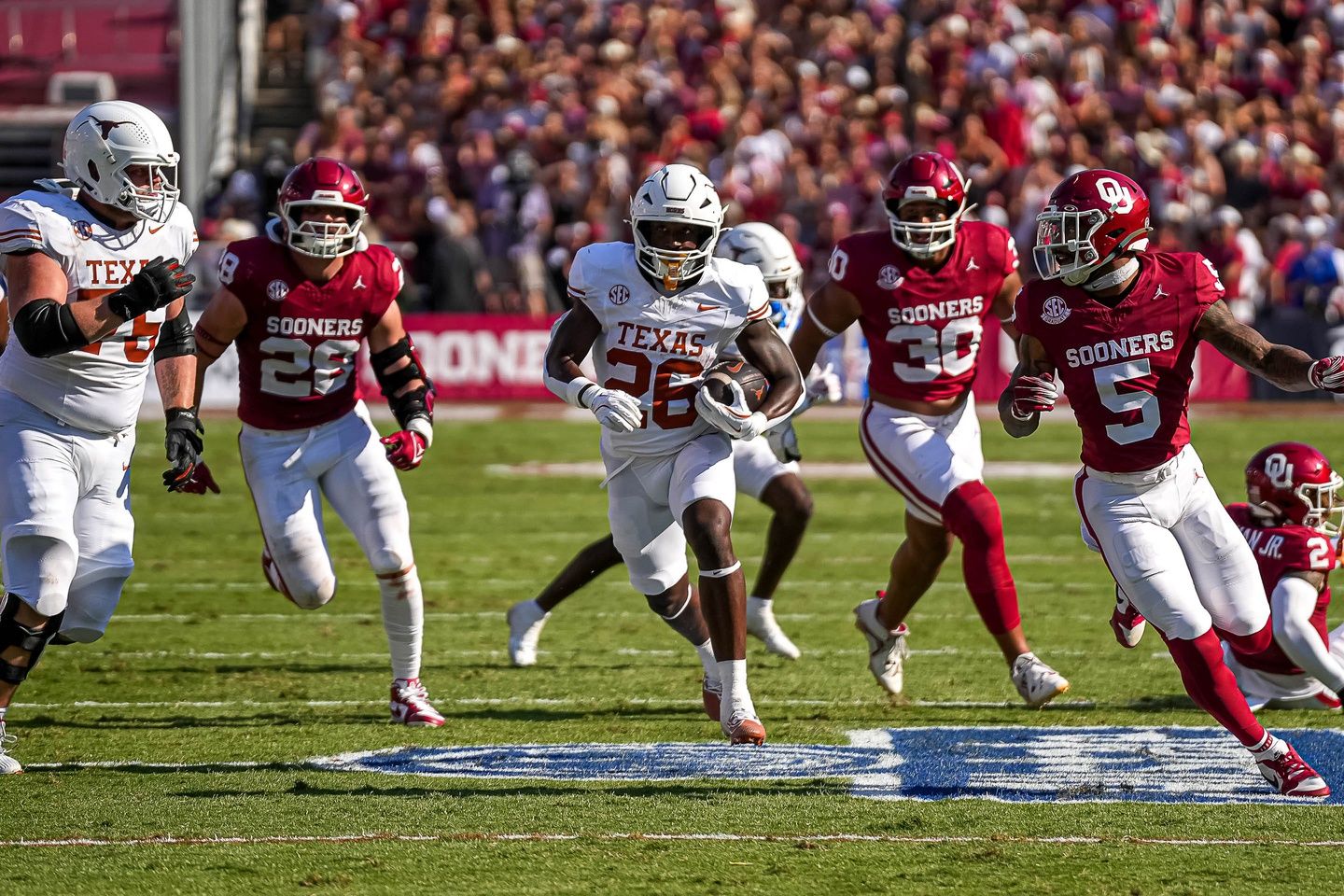 Texas Longhorns running back Quintrevion Wisner (26) runs the ball during the Red River Rivalry game against Oklahoma at the Cotton Bowl on Saturday, Oct. 12, 2024 in Dallas, Texas.
