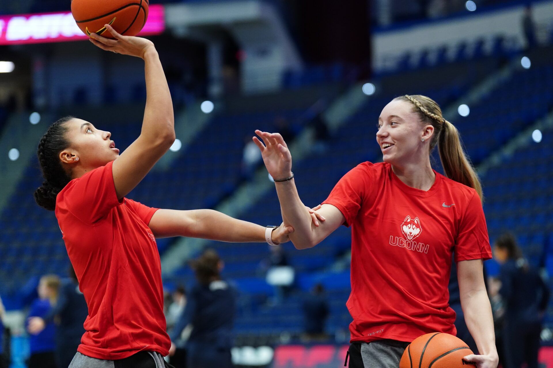 UConn Huskies guard Azzi Fudd (35) and guard Paige Bueckers (5) on the court as their teammates warm up before the start of the game against the Seton Hall Pirates at XL Center.