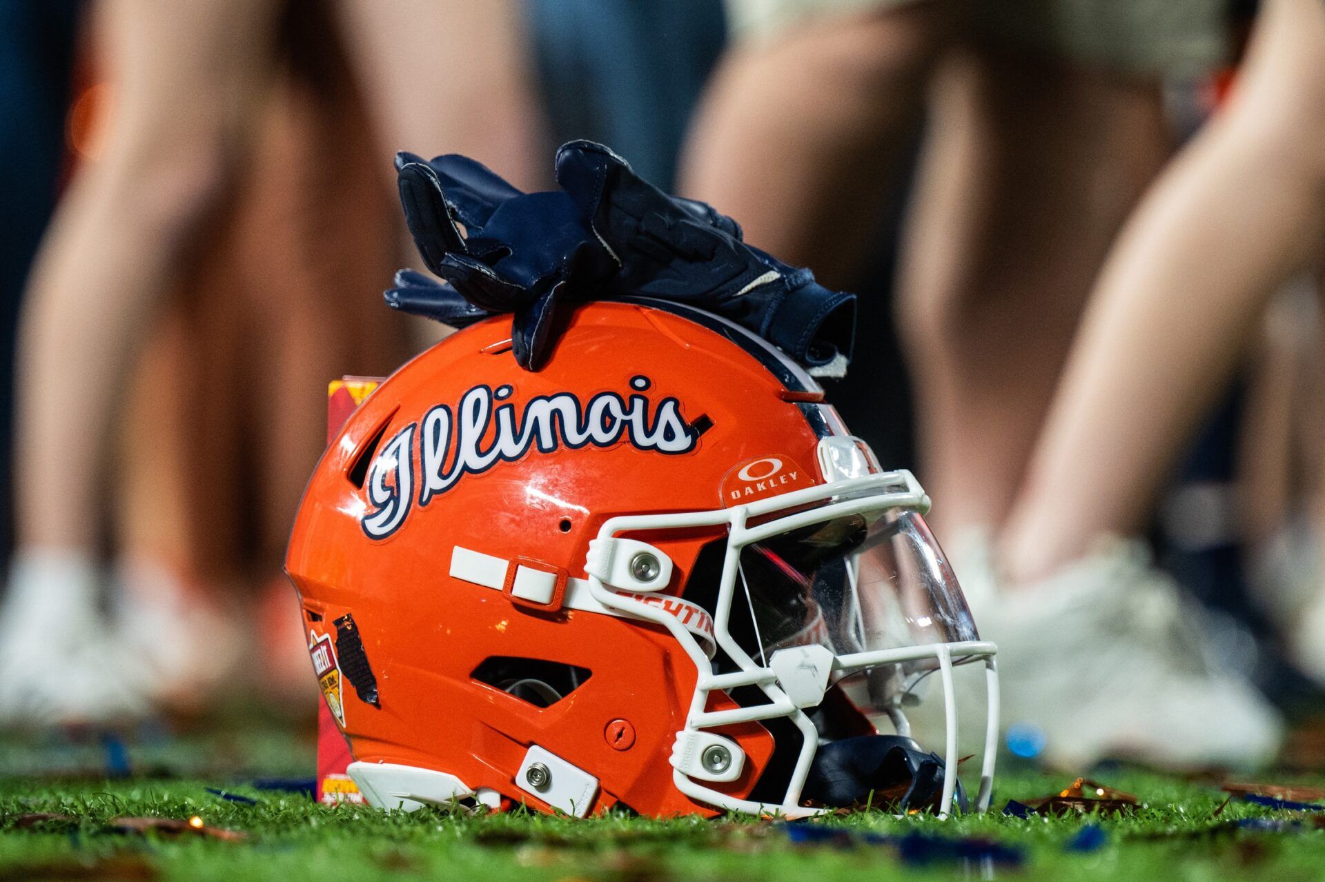 A Illinois Fighting Illini helmet sitting on confetti after the game against the South Carolina Gamecocks at Camping World Stadium.