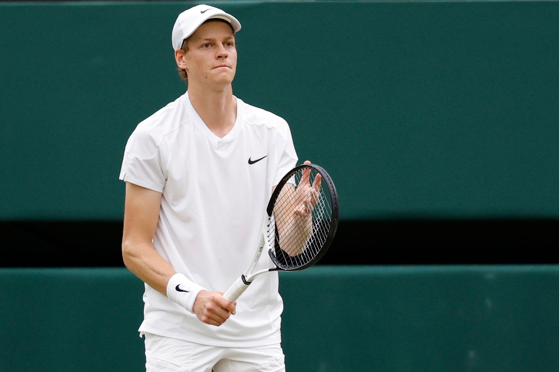 Jannik Sinner (ITA) reacts after missing a shot against Daniil Medvedev (not pictured) in a gentlemen's singles quarter-final match on day nine of The Championships Wimbledon 2024 at The All England Lawn Tennis Club.